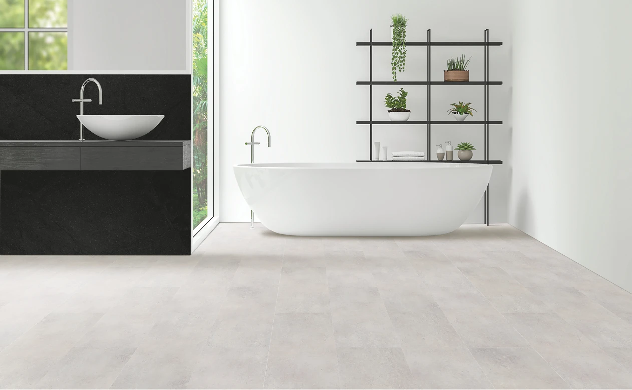 bathroom with gray tile flooring